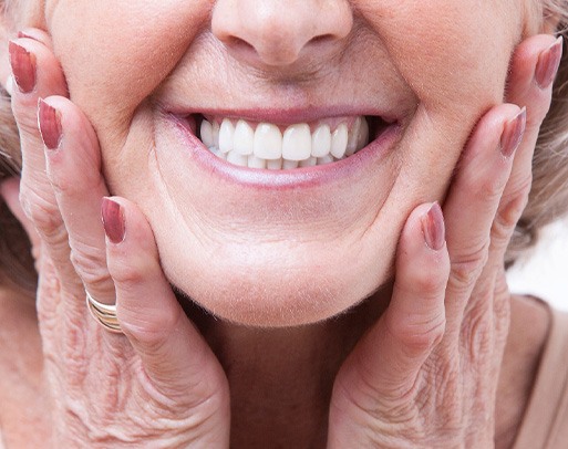 A woman wearing dentures