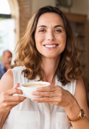 Woman with healthy smile after visiting her dentist