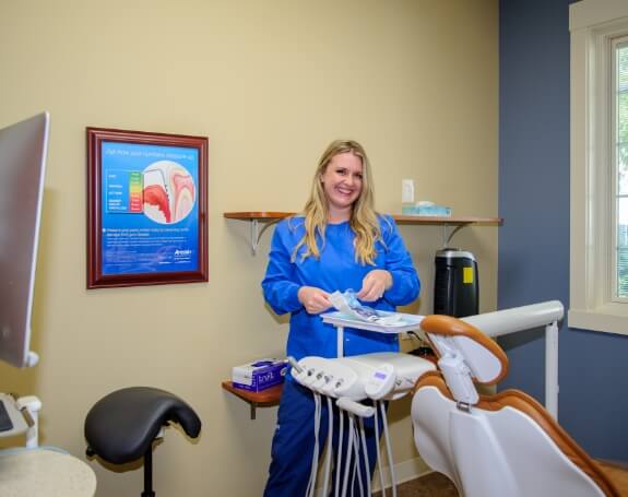 Dental team member in state-of-the-art dental treatment room