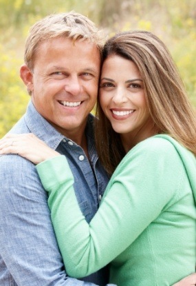 Man and woman with flawless smiles after cosmetic dentistry