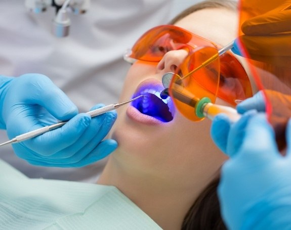 Patient receiving dental bonding treatment