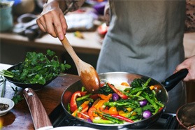 Cook roasting vegetables in skillet