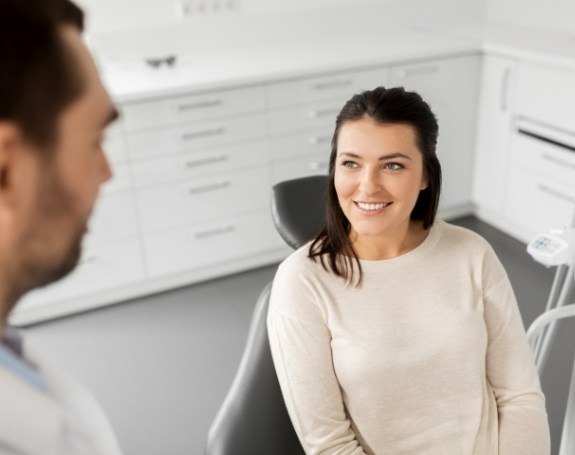 Dentist talking to dental patient