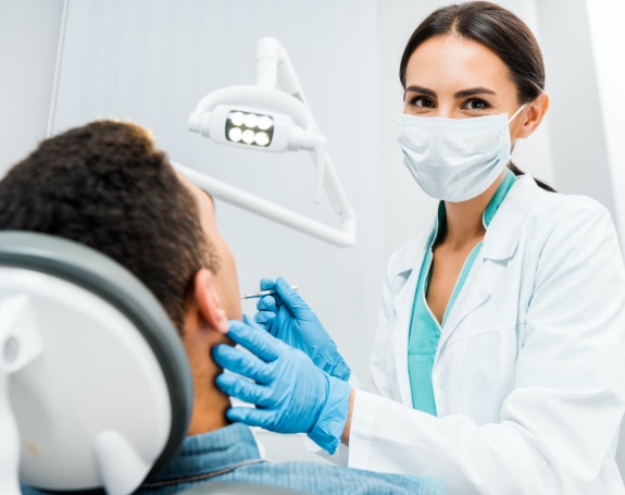 Dentist treating dental patient