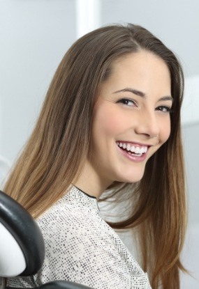 Smiling woman at preventive dentistry visit