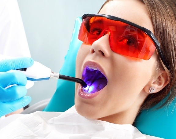 Patient receiving dental sealants