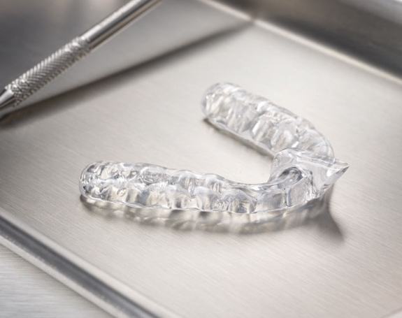 Clear nightguard for bruxism on metal tray