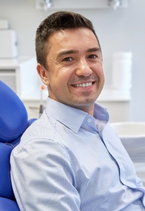 Man smiling after root canal therapy