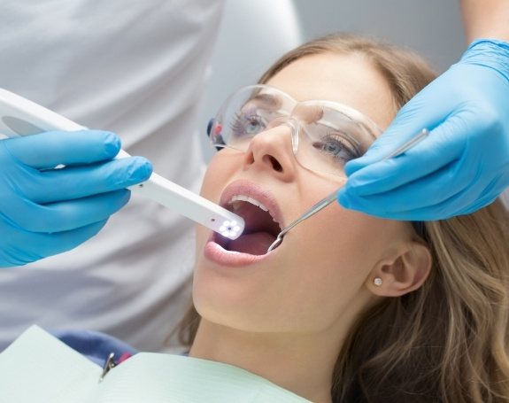 Dentist using intraoral camera to capture smile photos