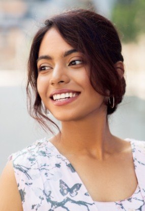 Woman with porcelain veneers smiling