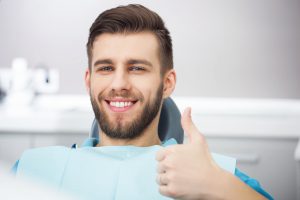 Smiling patient in the dental chair