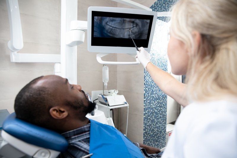 dentist showing patient their x-ray