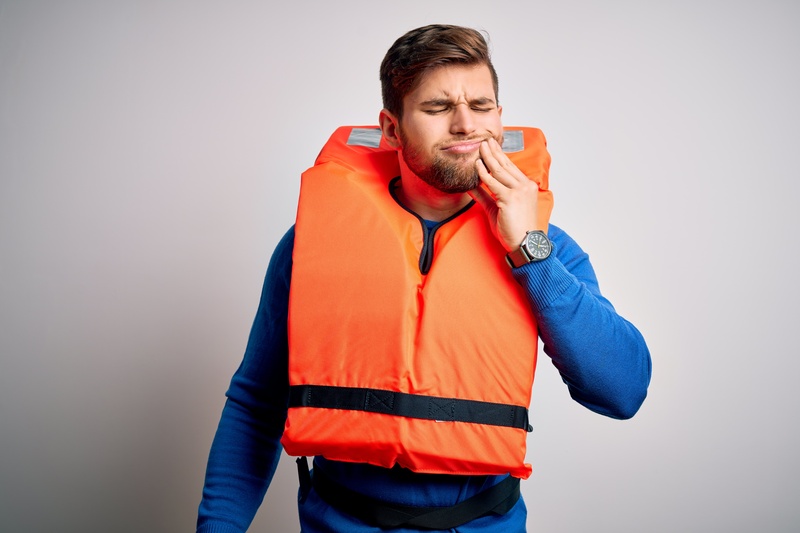 Young blond tourist having a dental emergency