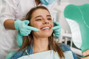 Young woman being examined at dentist's office.