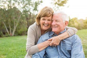 Smiling elderly couple