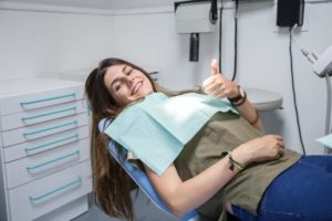 woman happy with visiting her dentist for preventive care